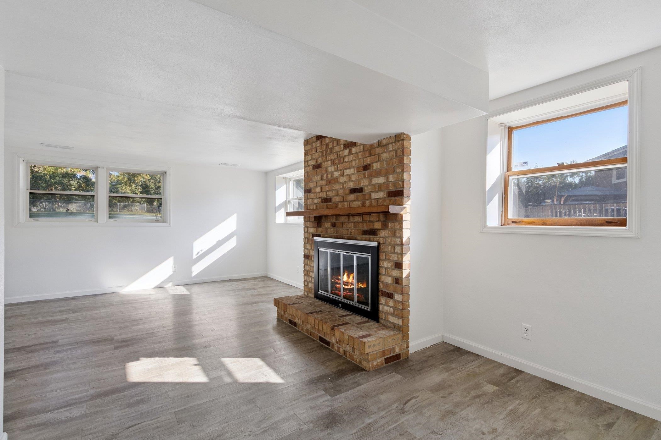 2724 Norway Pine Road Rockford, IL 61109 - Photo 22 of 49 a living room with furniture and a fireplace
