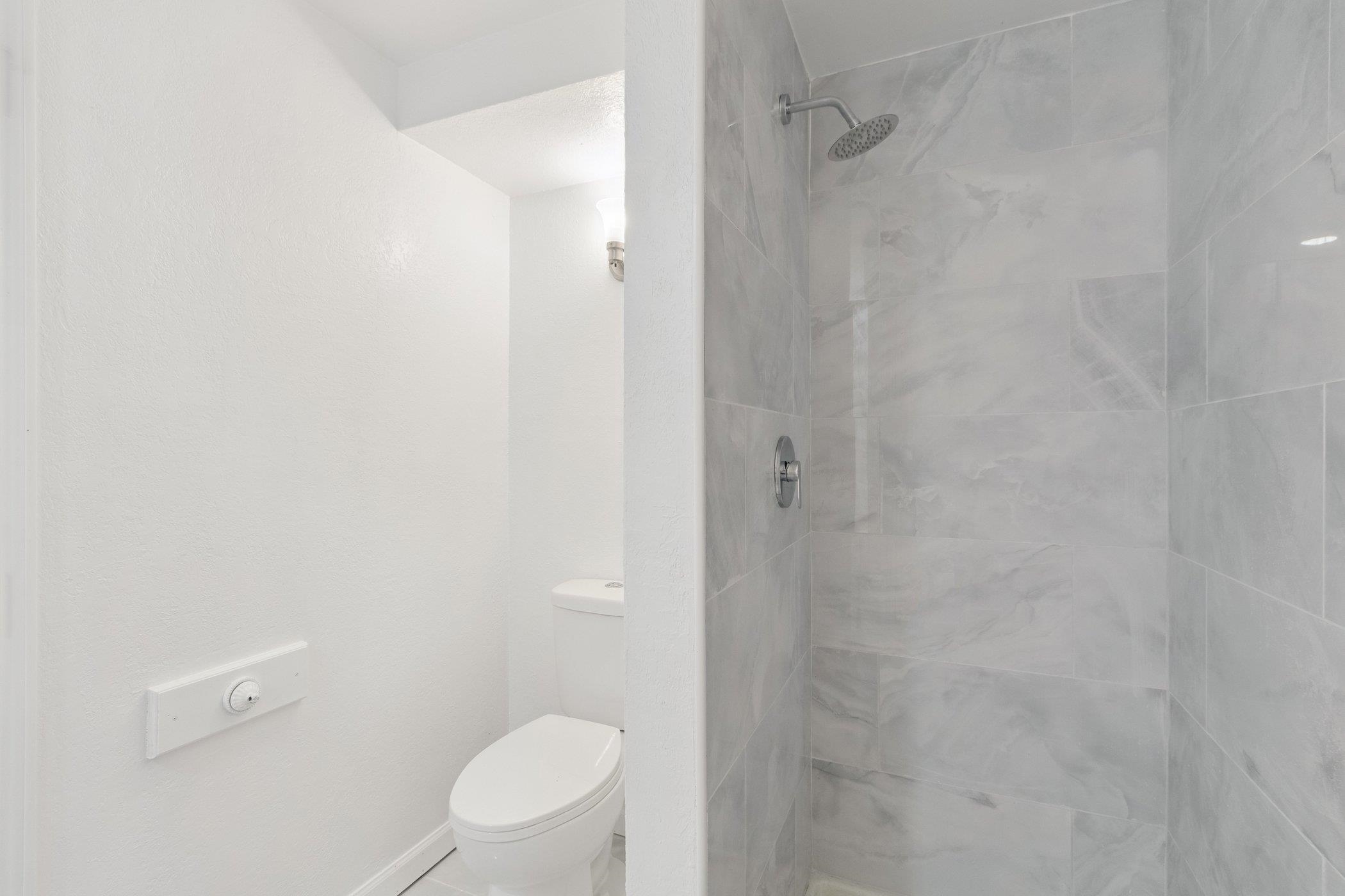 2724 Norway Pine Road Rockford, IL 61109 - Photo 25 of 49 a bathroom with a granite countertop toilet and a shower