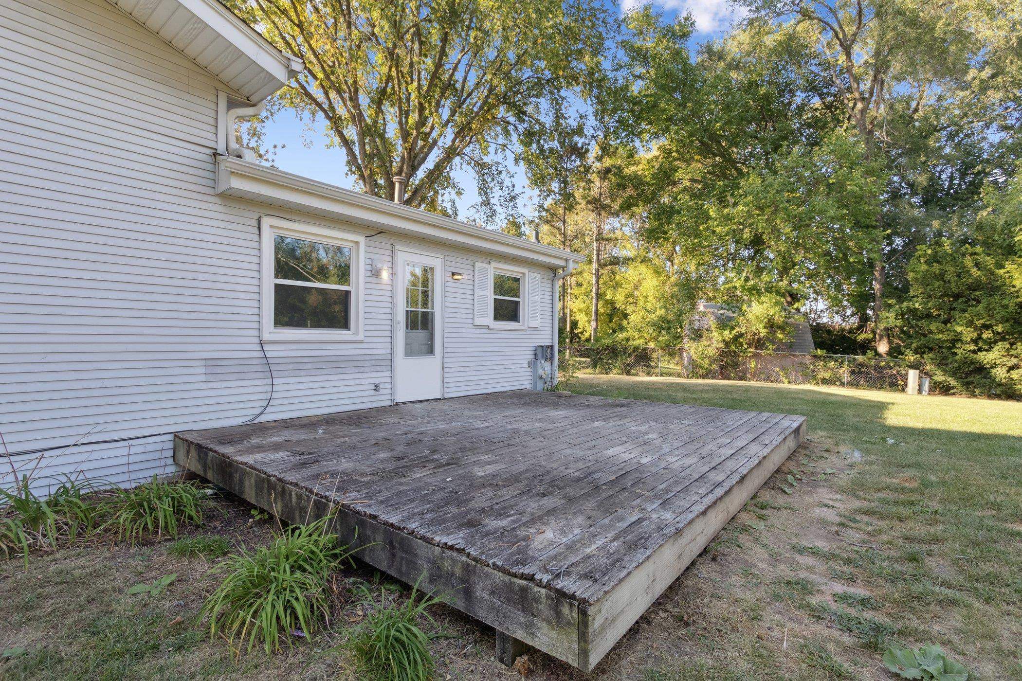 2724 Norway Pine Road Rockford, IL 61109 - Photo 43 of 49 a view of a backyard with a wooden fence