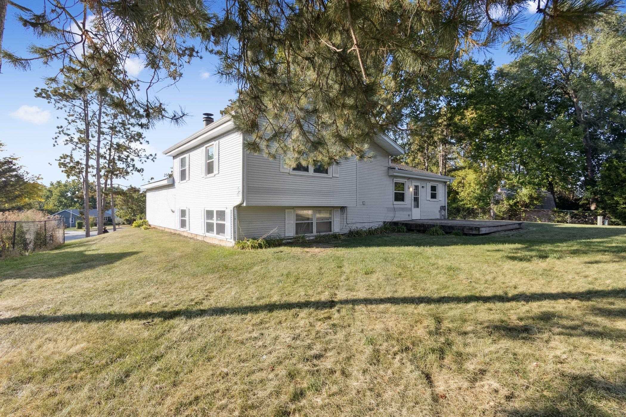 2724 Norway Pine Road Rockford, IL 61109 - Photo 46 of 49 a view of a house with a yard
