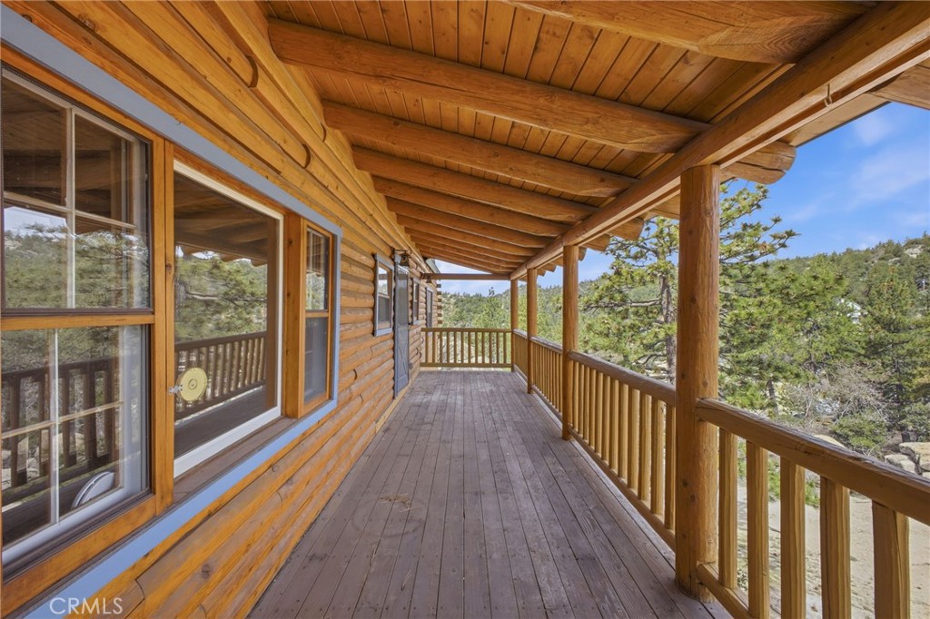 33052 Donner Lane Running Springs, CA 92382 - Photo 12 of 36 a view of a balcony with wooden floor