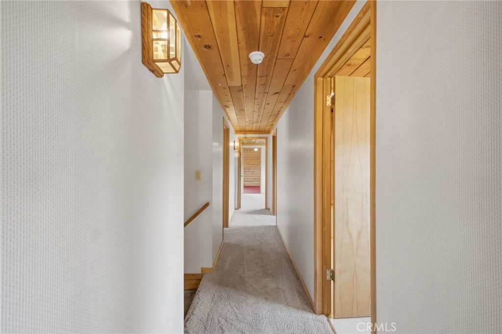 33052 Donner Lane Running Springs, CA 92382 - Photo 17 of 36 a view of a hallway with a window