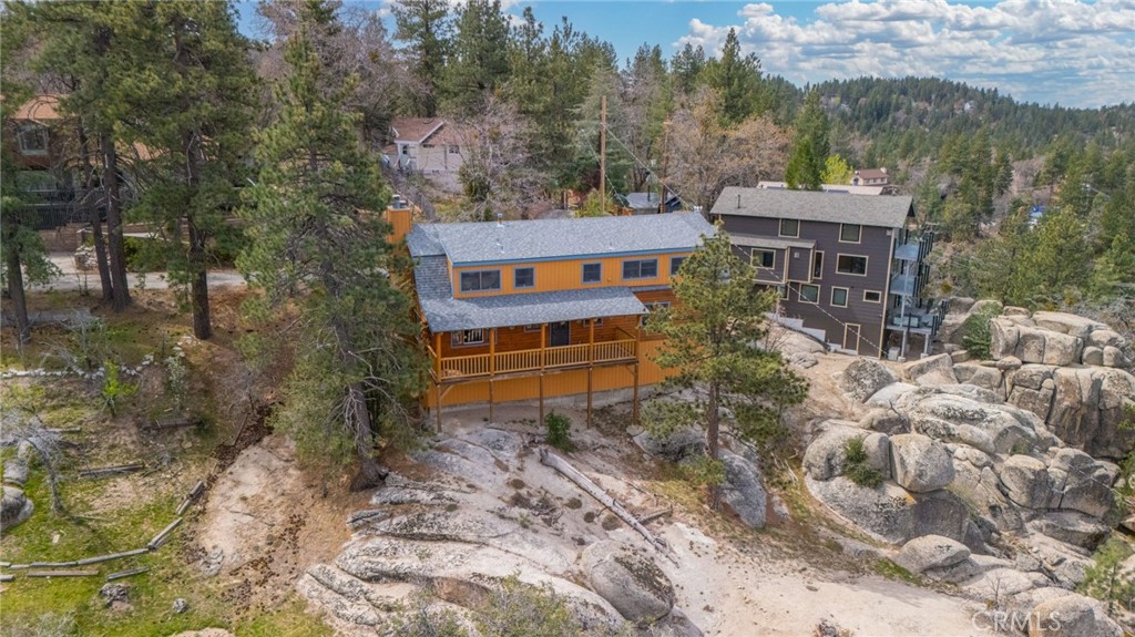 33052 Donner Lane Running Springs, CA 92382 - Photo 33 of 36 a view of a house with a yard