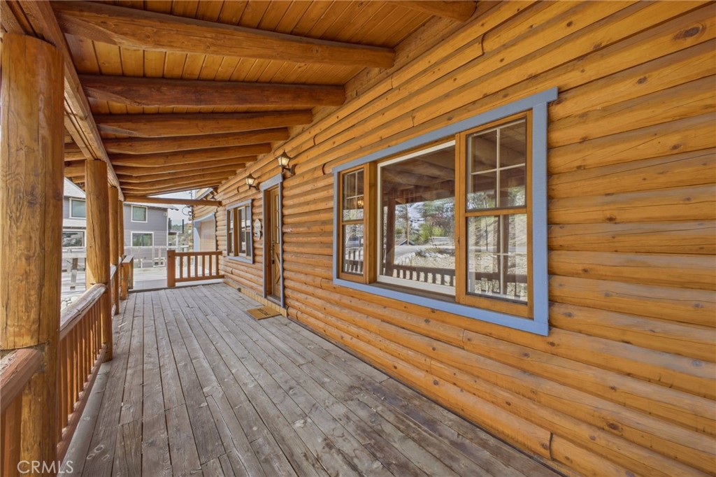33052 Donner Lane Running Springs, CA 92382 - Photo 4 of 36 a view of a room with wooden floor and windows