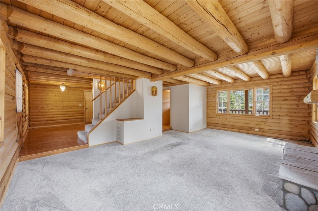 33052 Donner Lane Running Springs, CA 92382 - Photo 6 of 36 a view of an empty room with a window