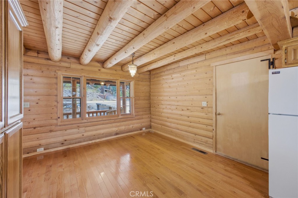 33052 Donner Lane Running Springs, CA 92382 - Photo 10 of 36 a view of empty room with wooden floor and fan
