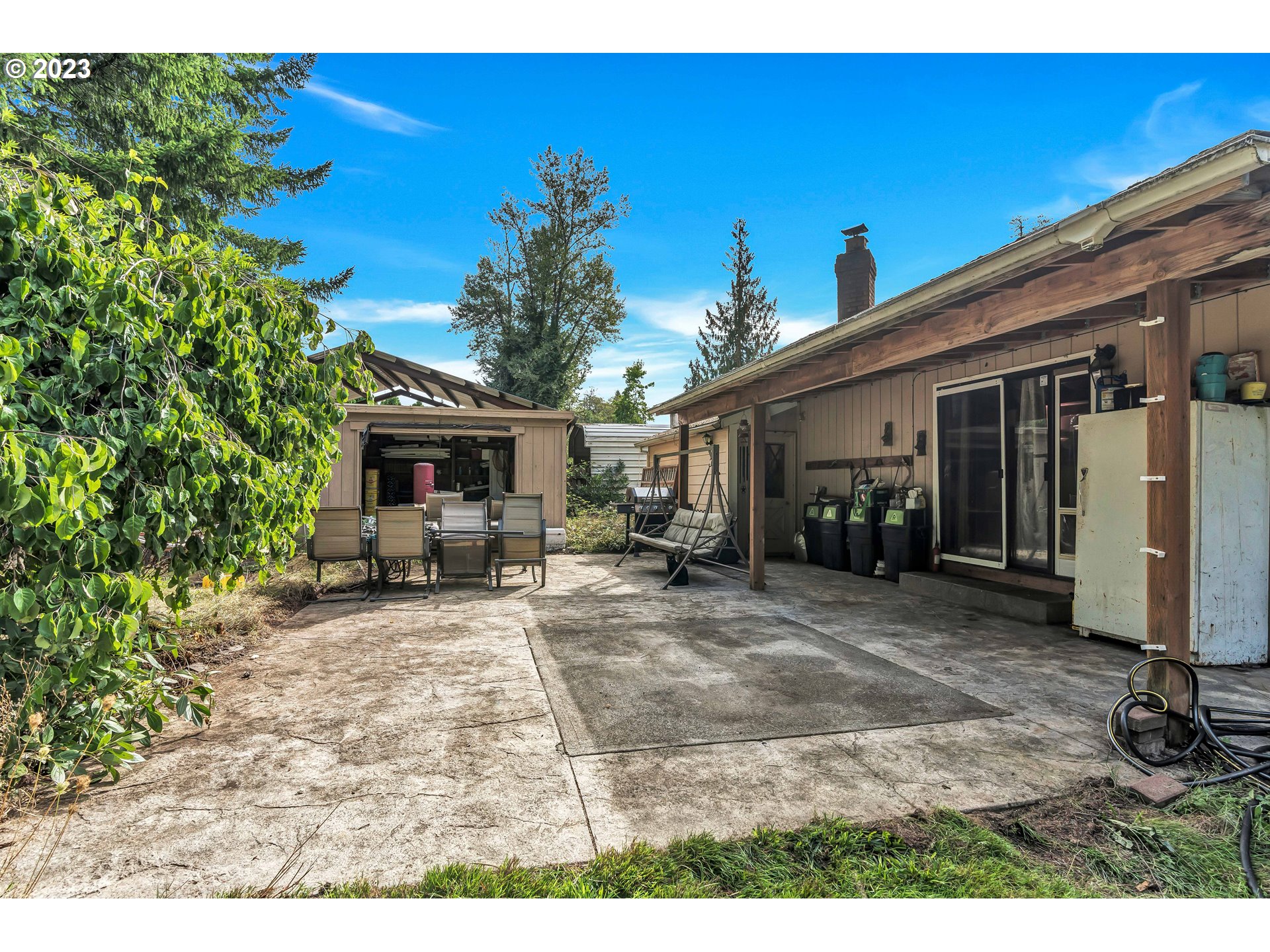 47431 Southeast Wagoneer Loop Sandy, OR 97055 - Photo 24 of 34 a view of a house with backyard and sitting area