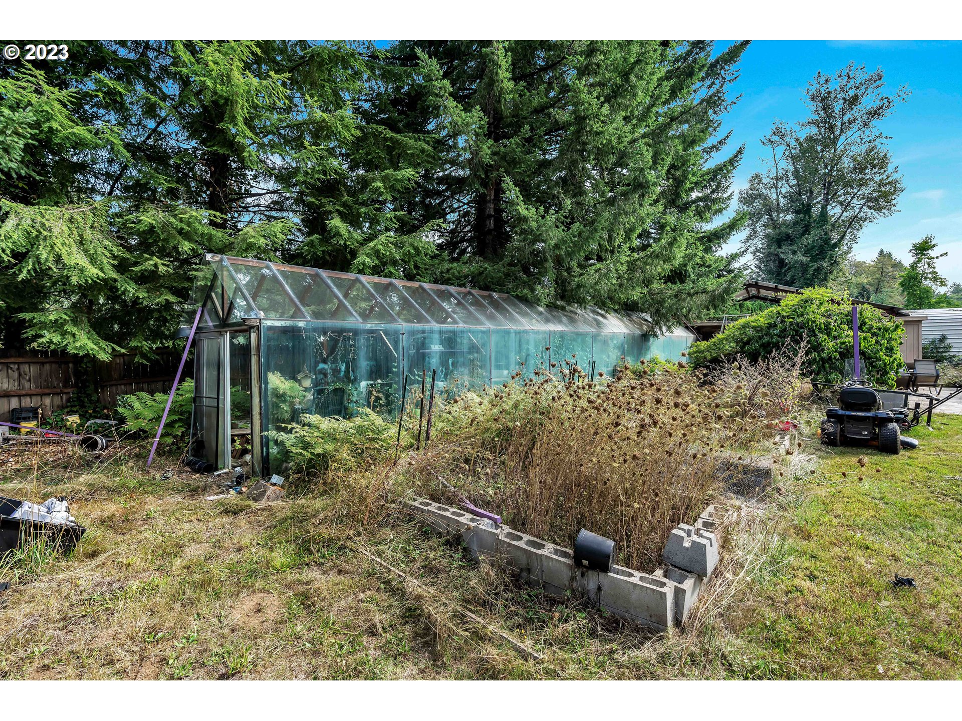 47431 Southeast Wagoneer Loop Sandy, OR 97055 - Photo 27 of 34 a backyard of a house with lots of green space