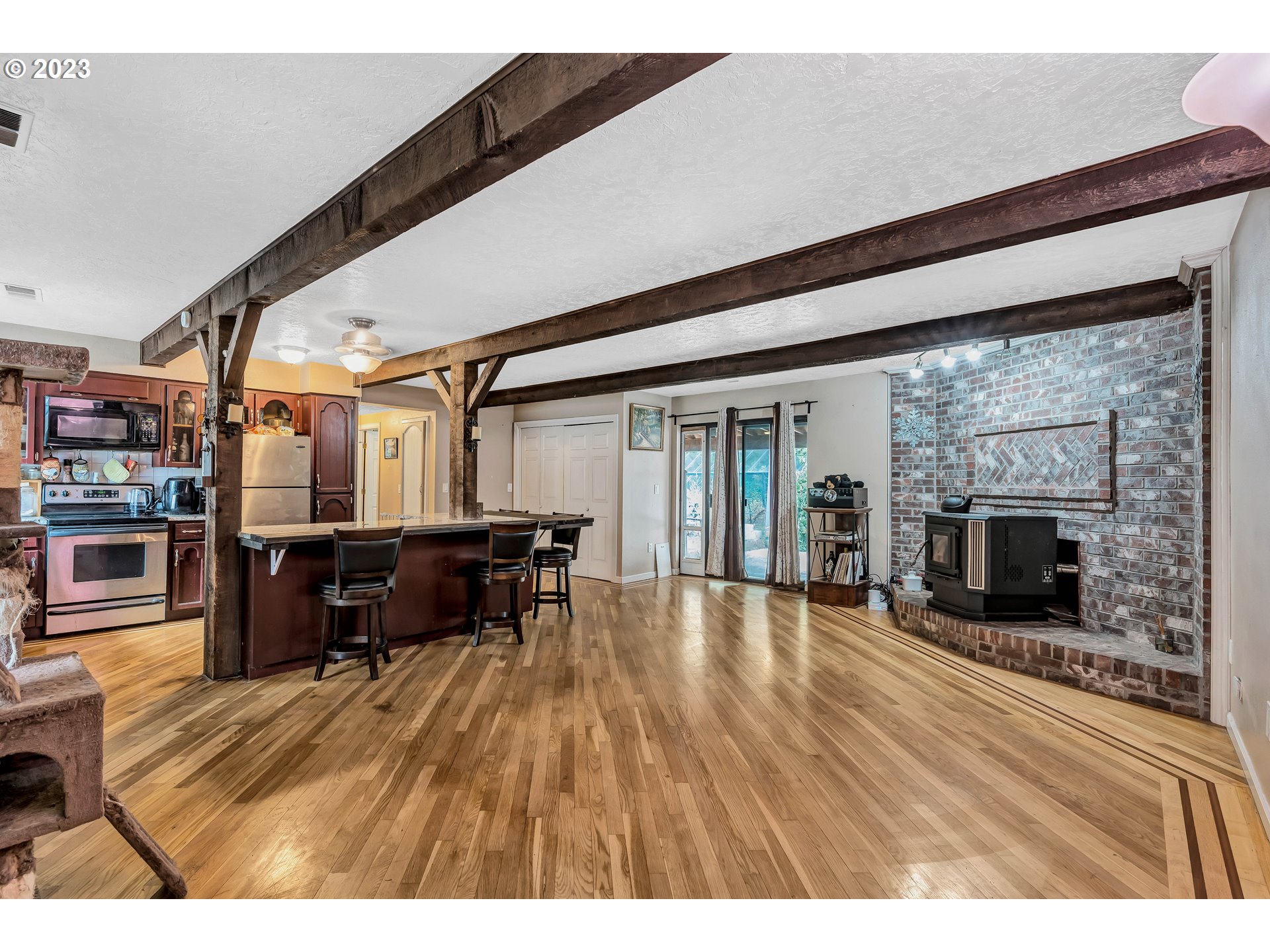 47431 Southeast Wagoneer Loop Sandy, OR 97055 - Photo 5 of 34 a living room with furniture and a fireplace