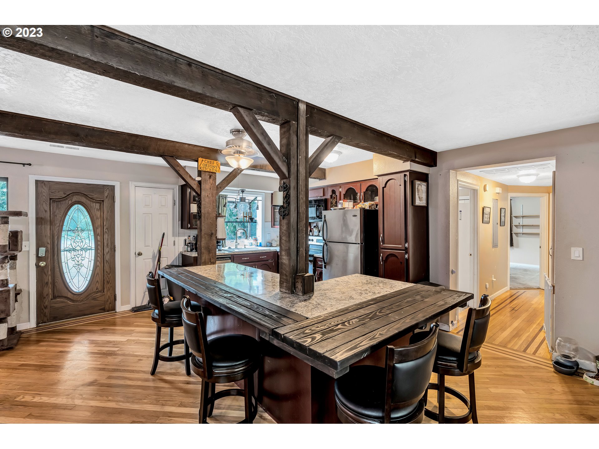 47431 Southeast Wagoneer Loop Sandy, OR 97055 - Photo 8 of 34 a dining room with a wooden table and chairs