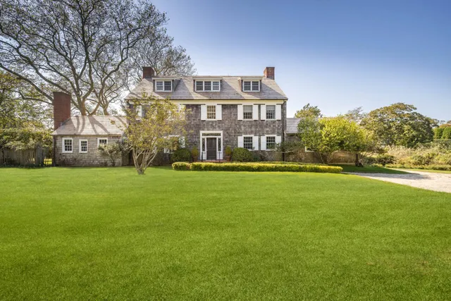 a front view of a building with garden