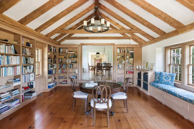 a view of a livingroom with furniture window and wooden floor