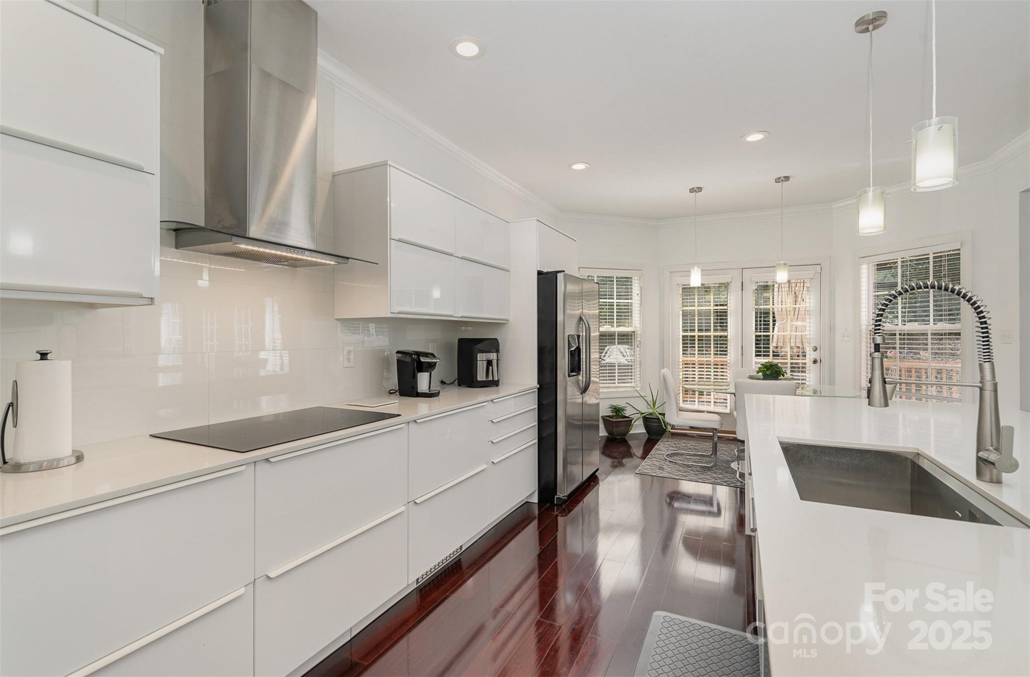 10929 Valley Spring Drive Charlotte, NC 28277 - Photo 11 of 43 a kitchen with stainless steel appliances granite countertop sink stove and refrigerator