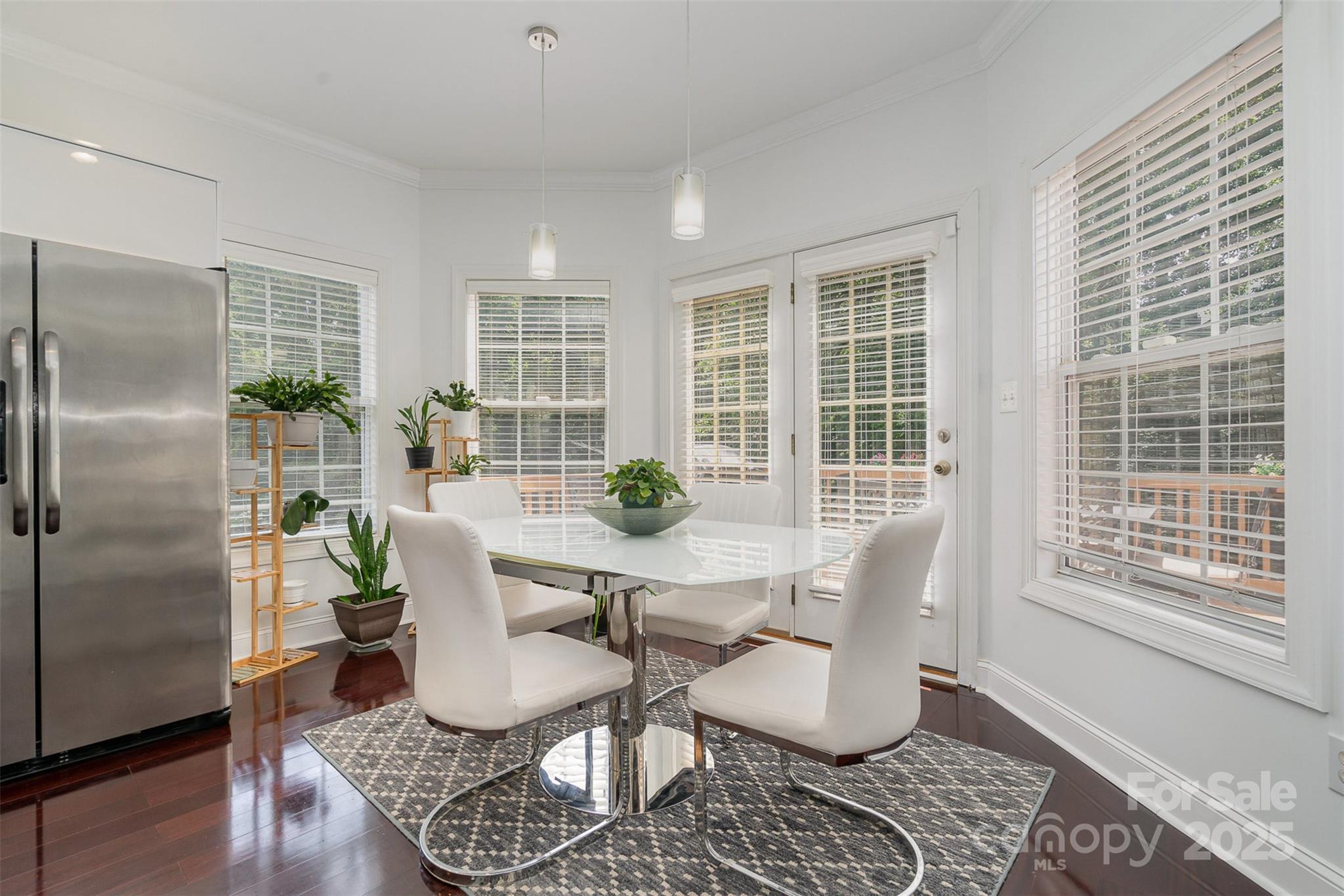 10929 Valley Spring Drive Charlotte, NC 28277 - Photo 12 of 43 a dining room with furniture a rug and wooden floor