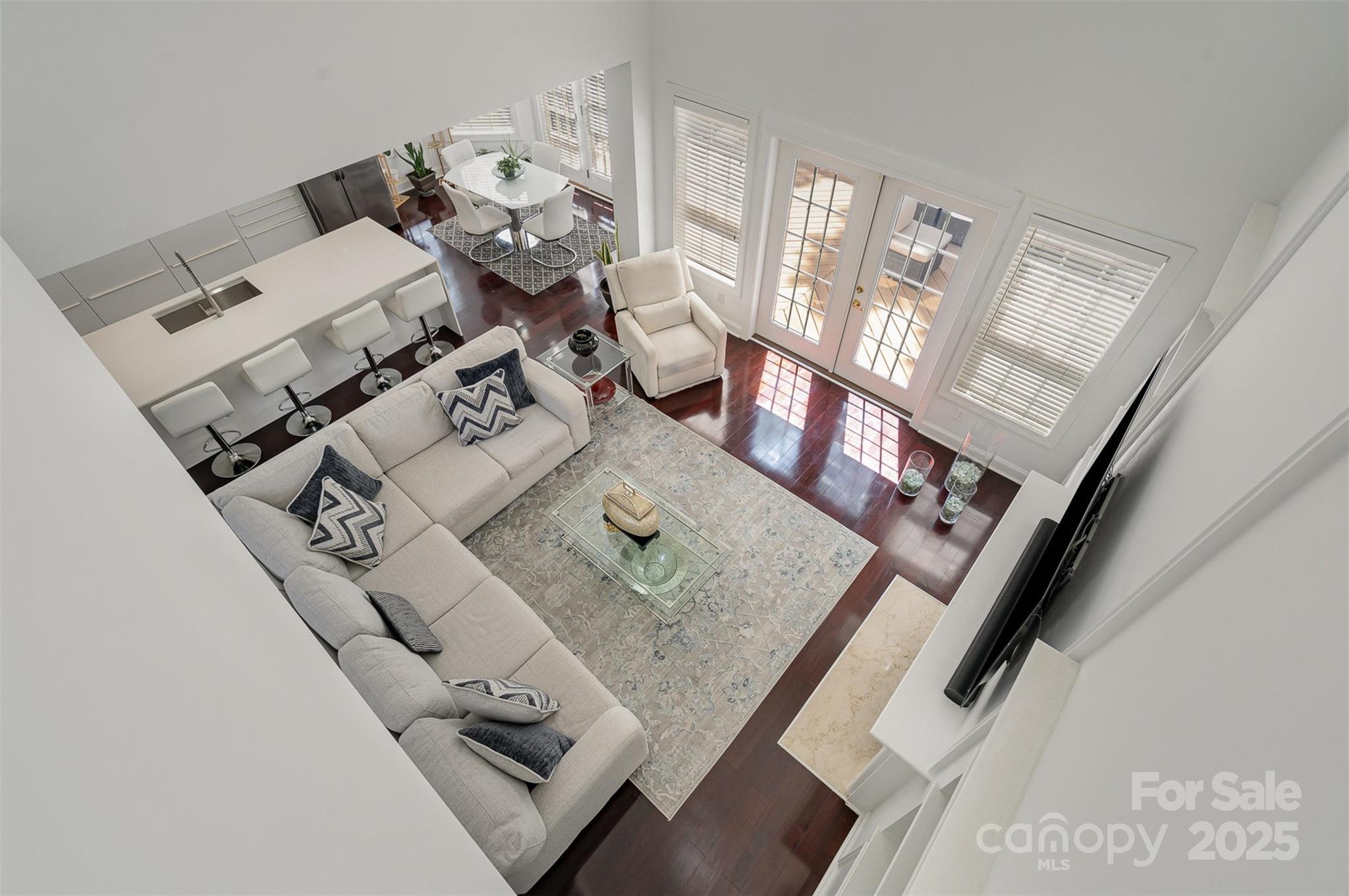 10929 Valley Spring Drive Charlotte, NC 28277 - Photo 14 of 43 a living room with furniture and floor to ceiling windows