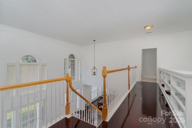 a view of a hallway with staircase