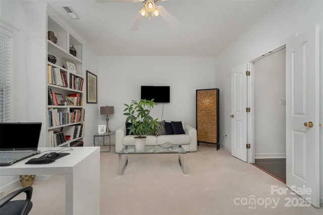 a workspace with furniture and bookshelf