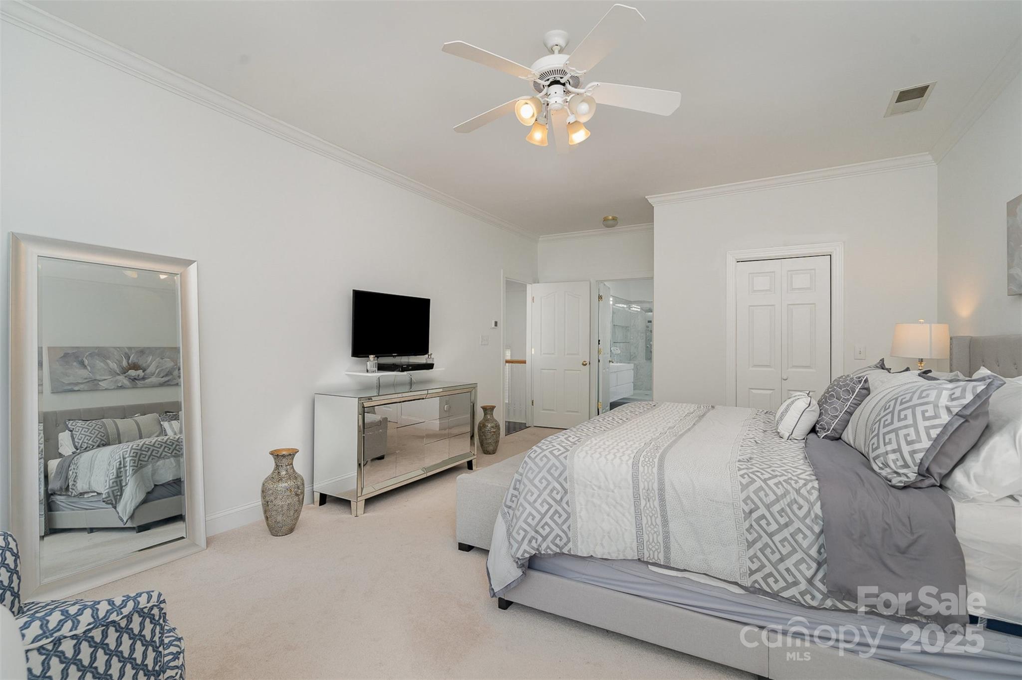 10929 Valley Spring Drive Charlotte, NC 28277 - Photo 20 of 43 a bedroom with a bed and a television