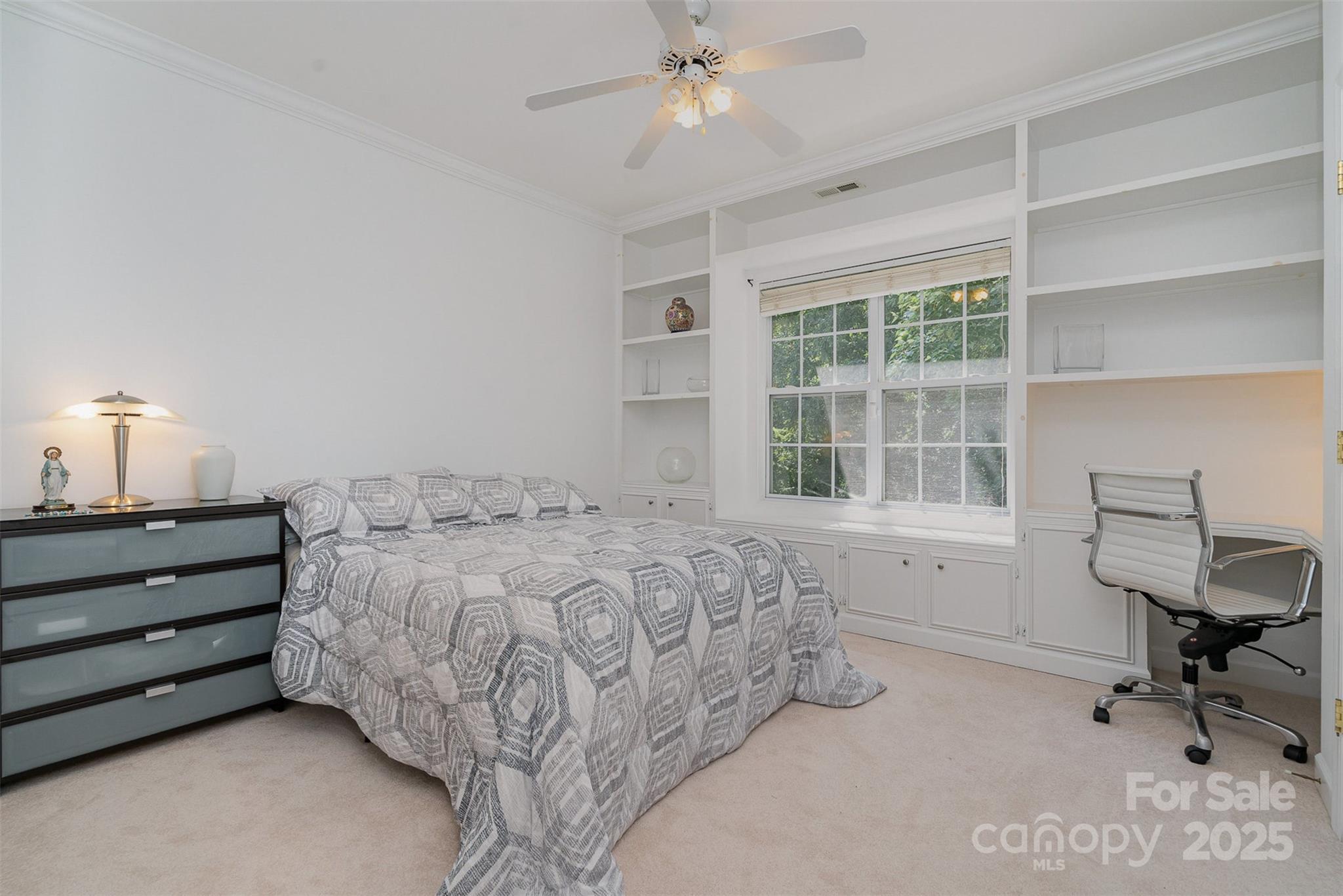 10929 Valley Spring Drive Charlotte, NC 28277 - Photo 28 of 43 a bedroom with a bed and a window