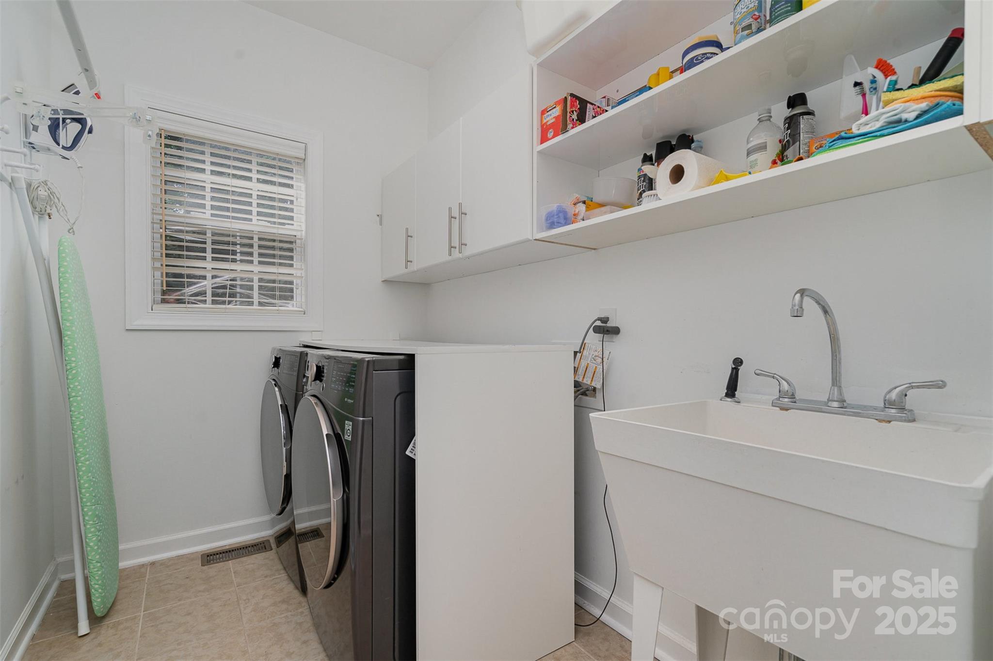 10929 Valley Spring Drive Charlotte, NC 28277 - Photo 30 of 43 a utility room with dryer and washer