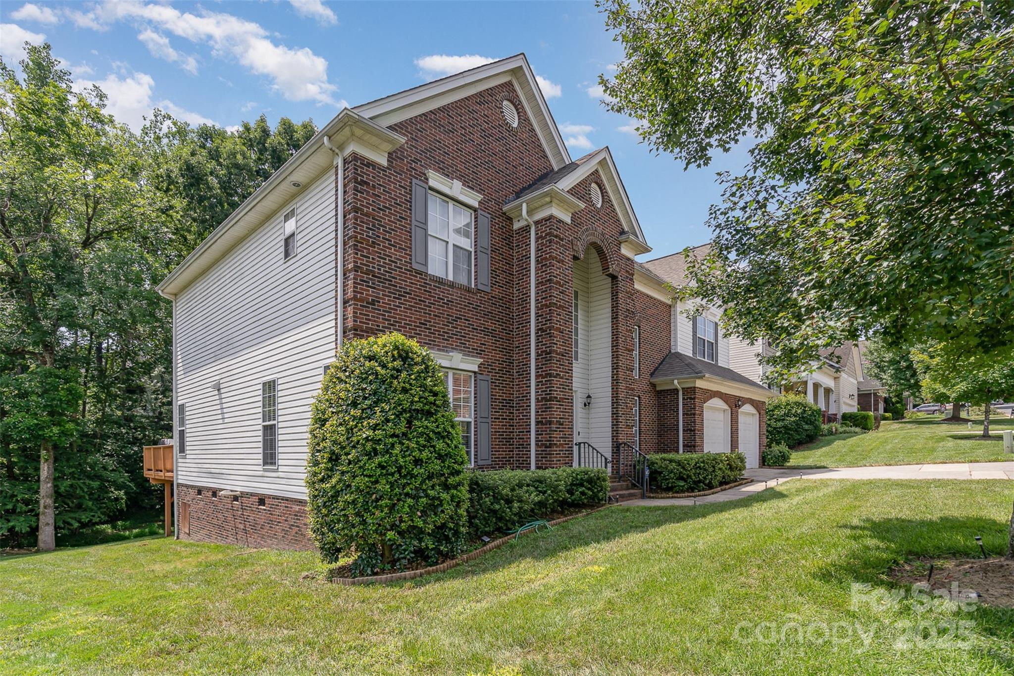 10929 Valley Spring Drive Charlotte, NC 28277 - Photo 32 of 43 a front view of a house with garden
