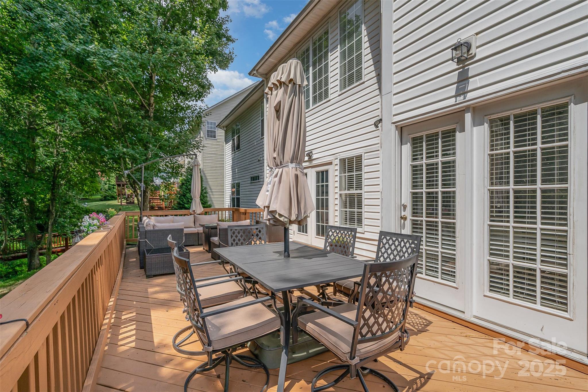 10929 Valley Spring Drive Charlotte, NC 28277 - Photo 34 of 43 a view of a patio with a table and chairs