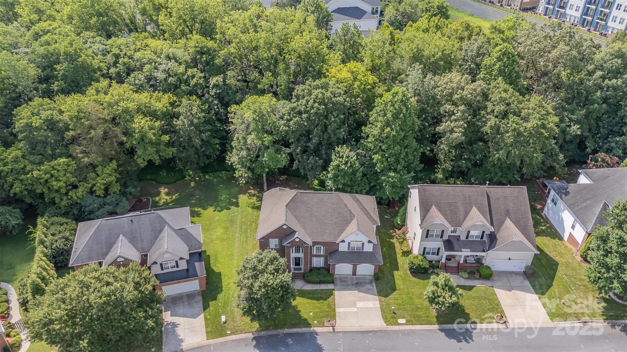 10929 Valley Spring Drive Charlotte, NC 28277 - Photo 38 of 43 an aerial view of a house with garden space and lake view