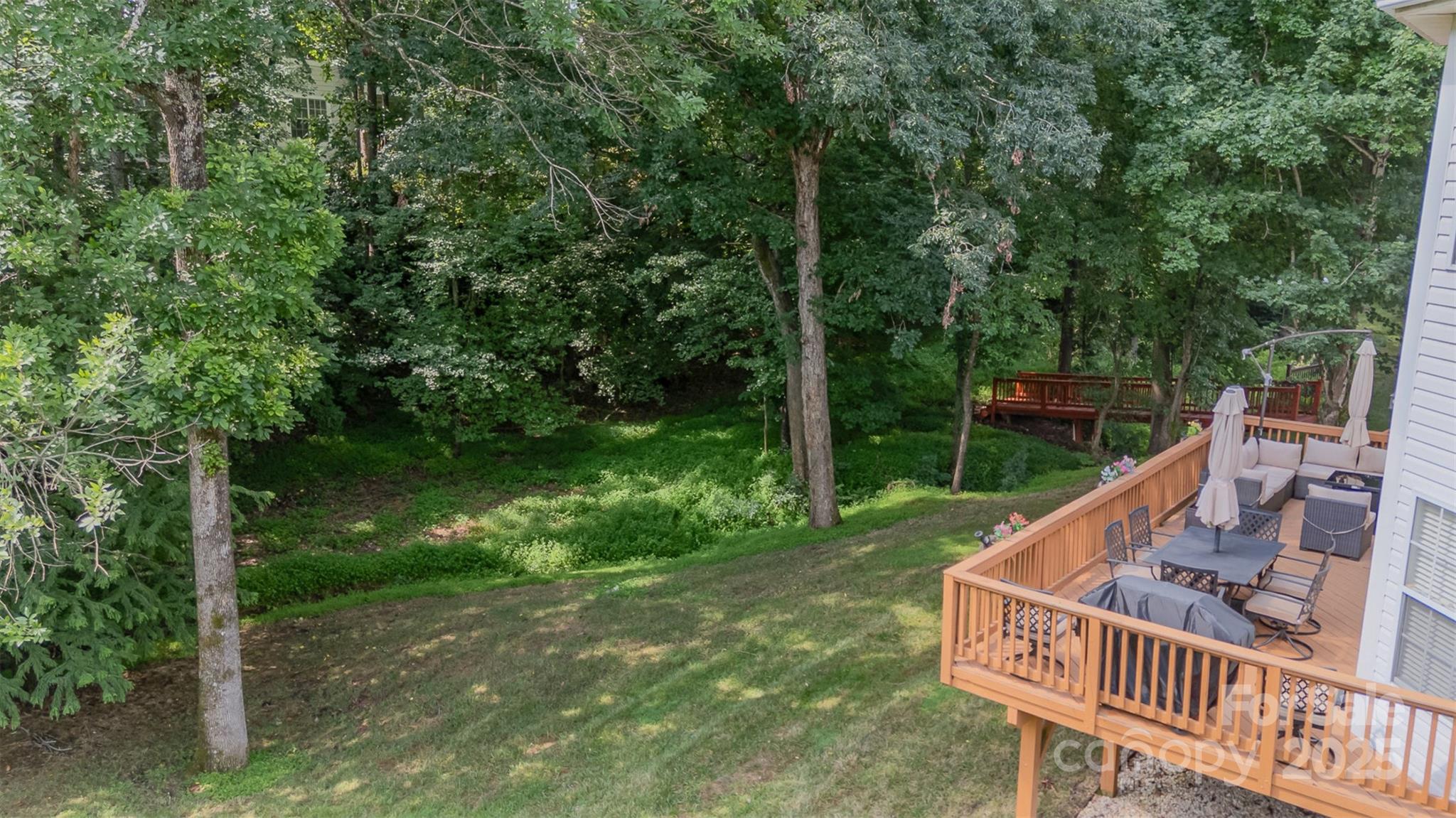 10929 Valley Spring Drive Charlotte, NC 28277 - Photo 40 of 43 a view of a roof deck with chair and wooden floor