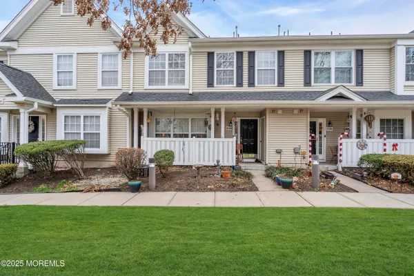 a view of a house with furniture and garden