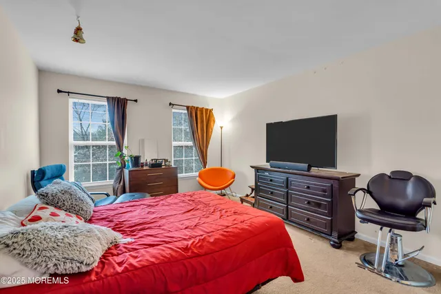 a bedroom with a bed and closet