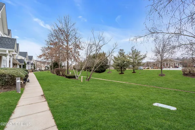 a front view of a house with outdoor seating