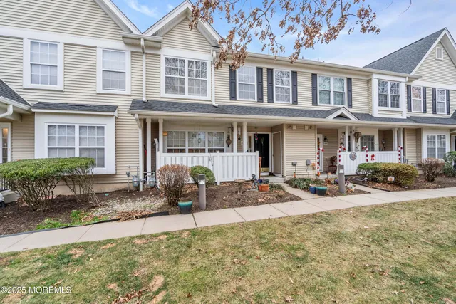 a view of a house with snow on the road