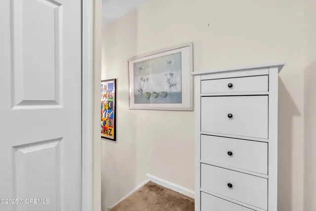 a view of a patio with dining table and chairs with wooden floor