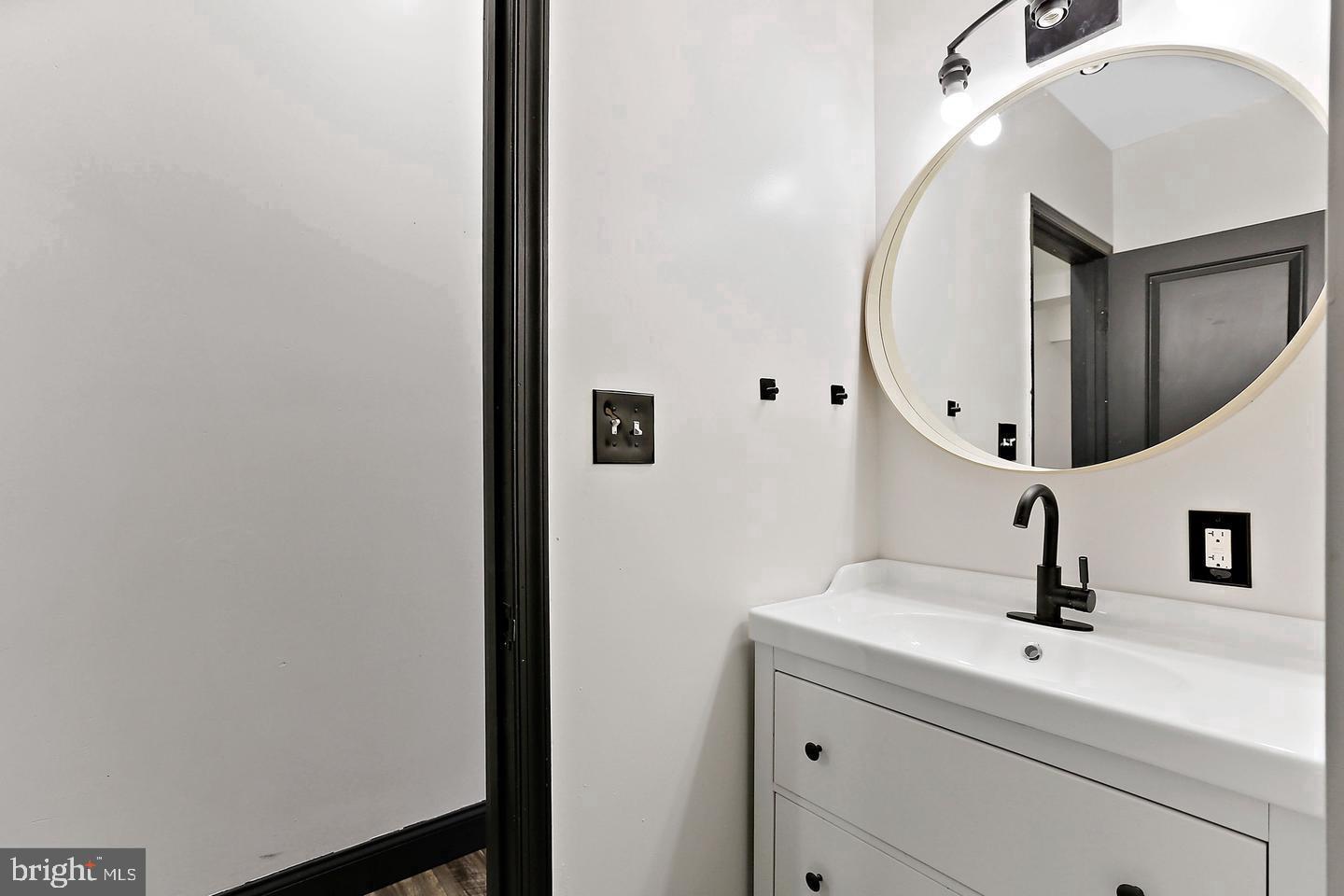 1732 McCulloh Street Baltimore, MD 21217 - Photo 17 of 30 a bathroom with a sink and mirror