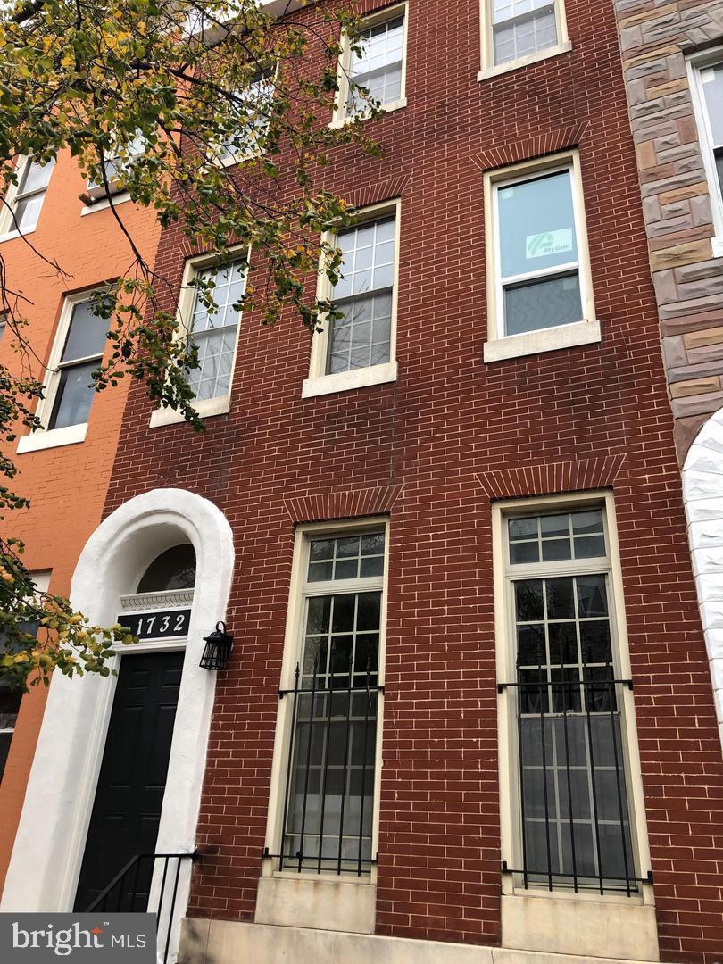 1732 McCulloh Street Baltimore, MD 21217 - Photo 3 of 30 a front view of a building with many windows