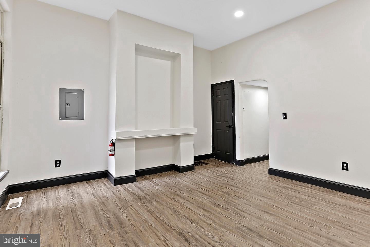 1732 McCulloh Street Baltimore, MD 21217 - Photo 6 of 30 an empty room with wooden floor and closet