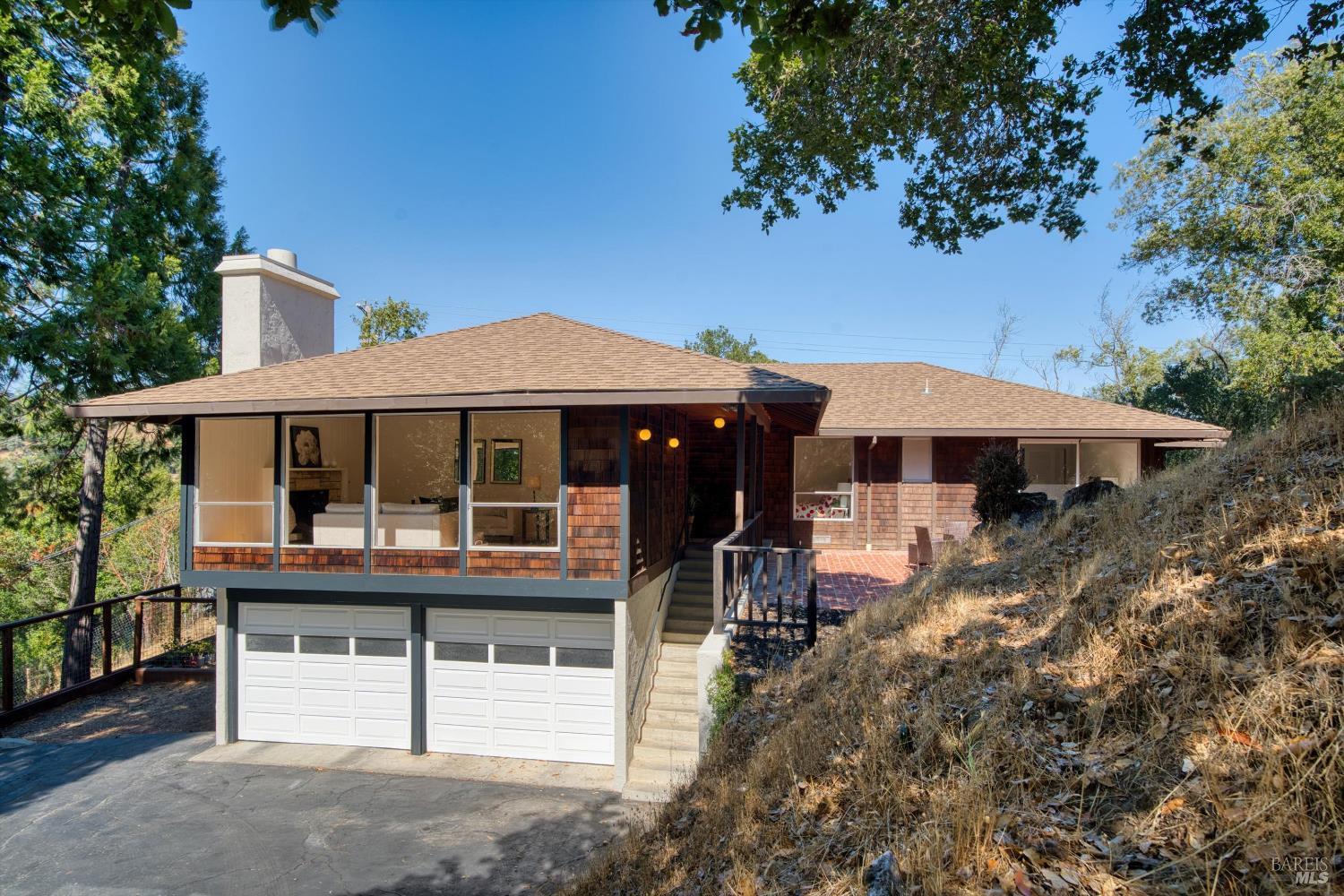 131 Legend Road San Anselmo, CA 94960 - Photo 1 of 1 a front view of a house with yard and porch