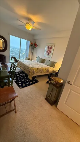 a bedroom with bed and window