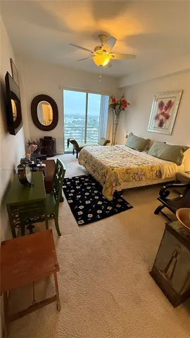 a bedroom with bed and a window