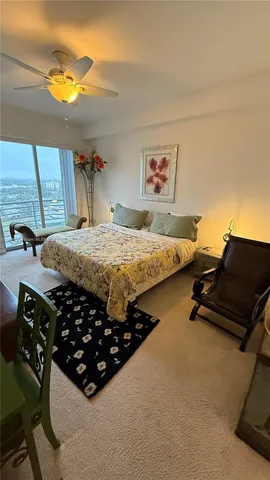 a bedroom with a bed and dresser