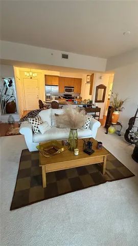 a view of living room with patio furniture