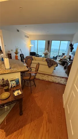 a bedroom with furniture and a wooden floor