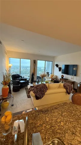 a bedroom with two beds and a large window