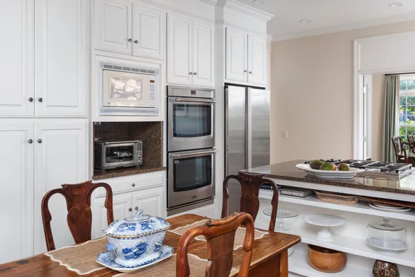 a kitchen with a appliances and cabinets