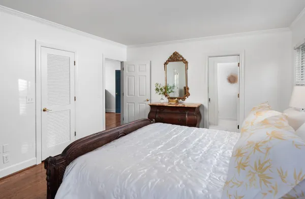 a bedroom with a large bed and a view of bedroom