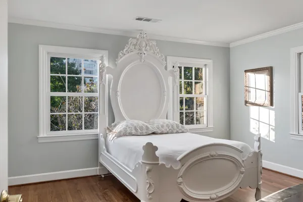 a living room with a bed furniture and a window