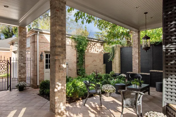 a view of a chairs and table in patio