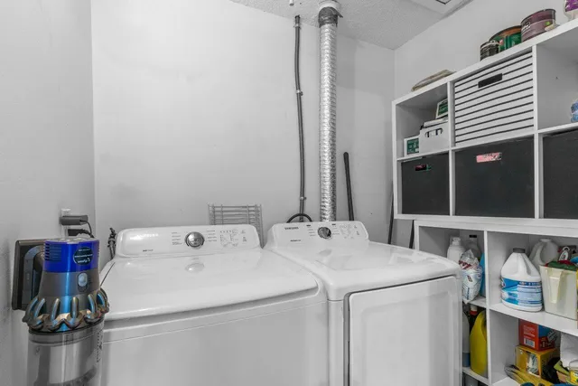a utility room with dryer and washer