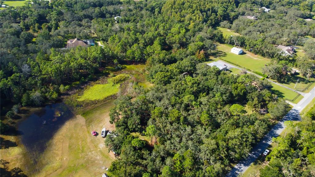 9670 Star Trail New Port Richey, FL 34654 - Photo 18 of 29 an aerial view of a houses with yard