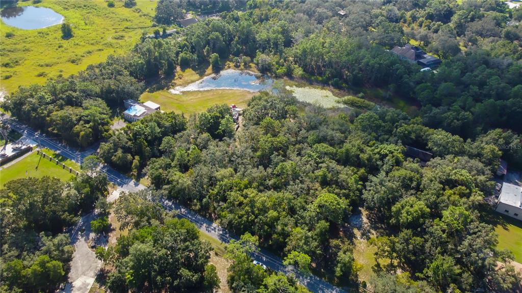 9670 Star Trail New Port Richey, FL 34654 - Photo 20 of 29 an aerial view of residential houses with outdoor space and trees